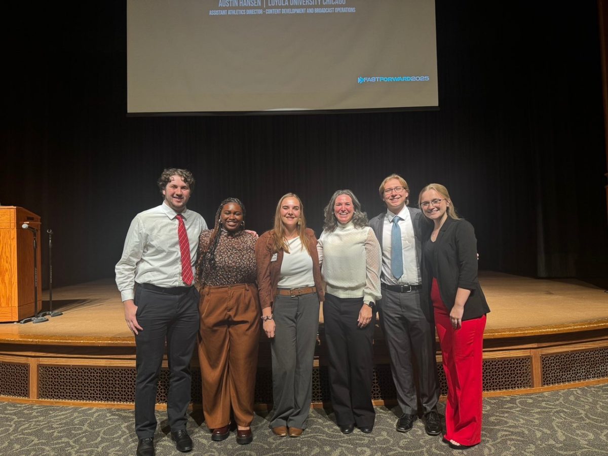 Four Wartburg students meet with Wartburg Alumni at the UNI Fast Forward Conference.