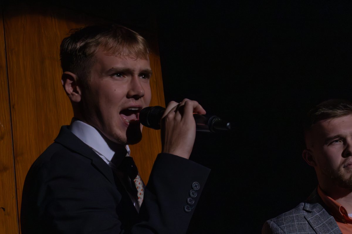 Landon Jepson announces the next performance during a Kastle Kapers dress rehersal.