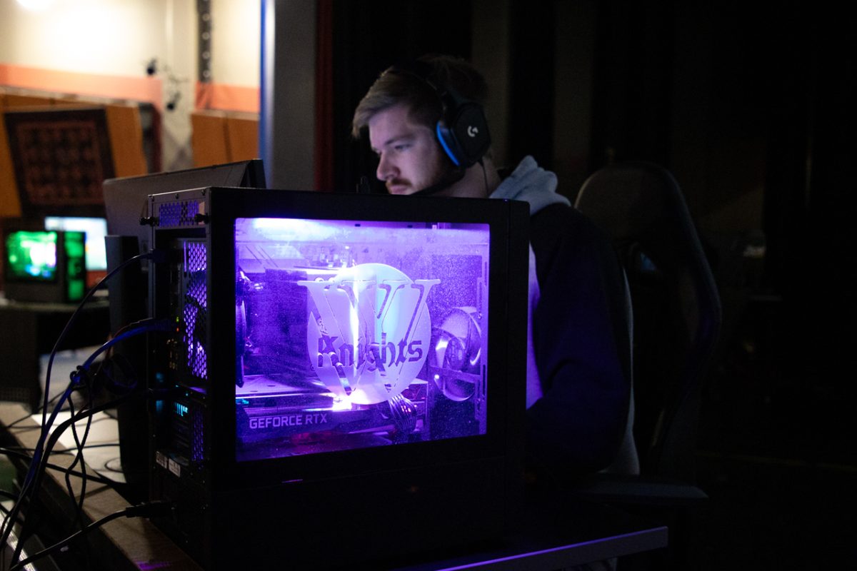 John Fischer, the Wartburg Esports head coach, watches his players battle out a win in their first local area network tournament.