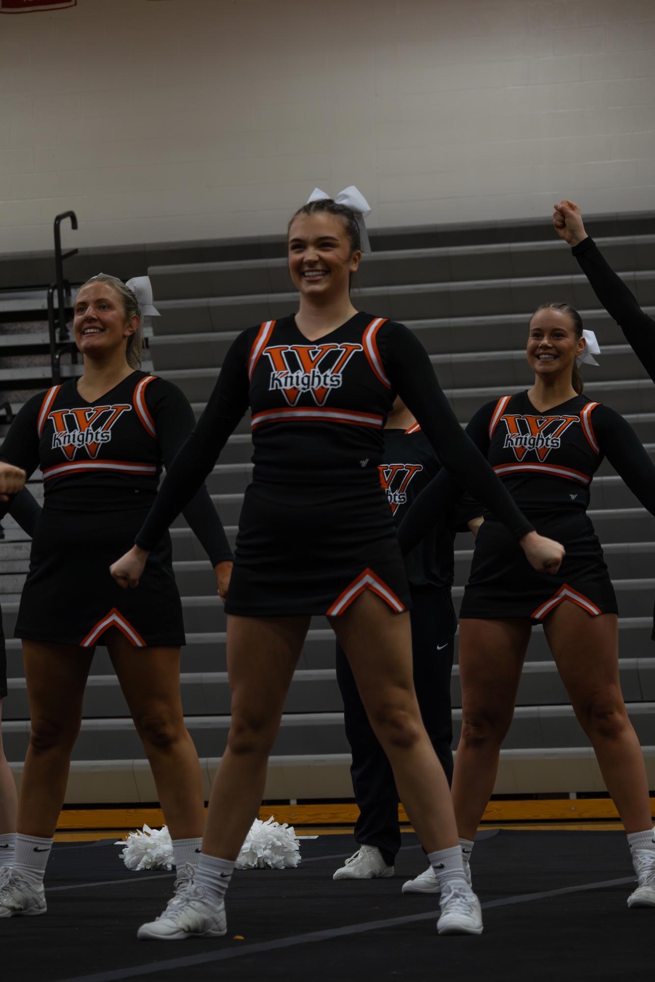 Wartburg Cheer team members performing their game day routine. 