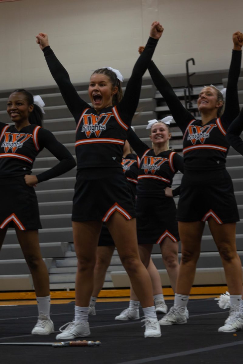 Wartburg Cheer team members pumped up about their game day performance.
