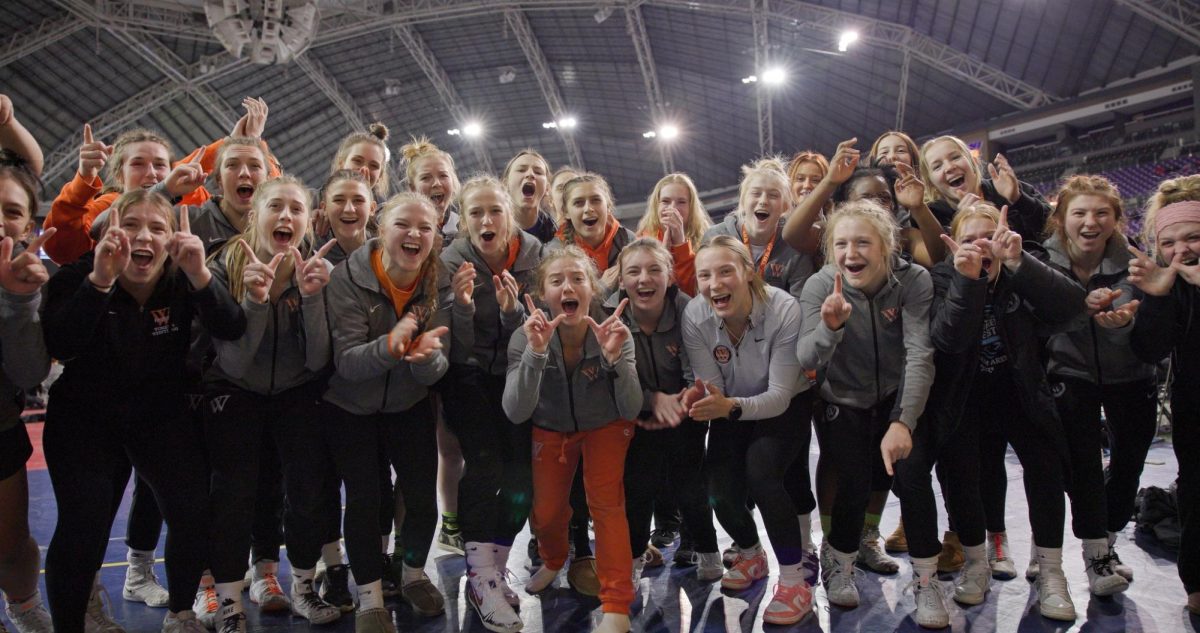 The Wartburg Women's Wrestling team celebrates after earning the championship title at the NWCA National Duals on Jan. 10.