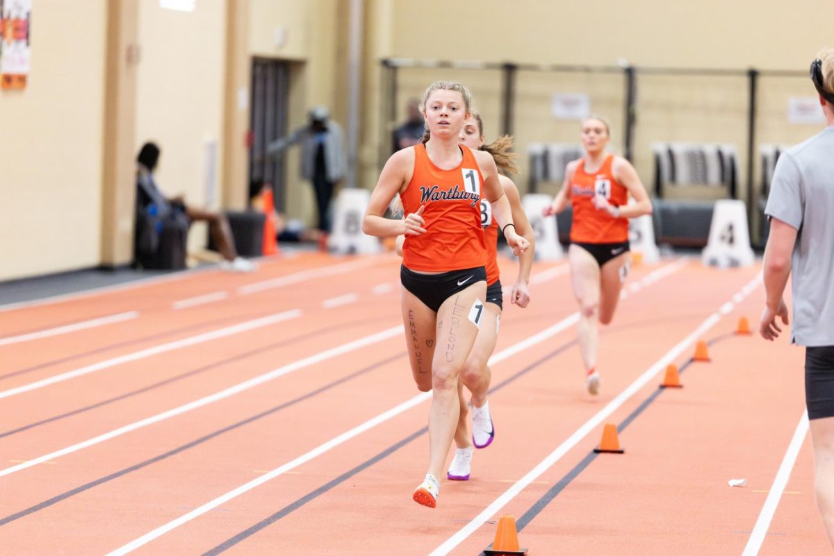 Senior Haley Meyer strides on top of the track during the Chelsey Henkenius Open on Jan. 17.