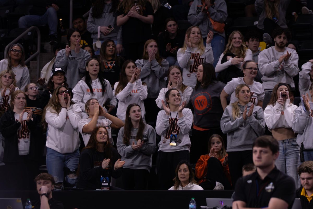 Kylie Rule's teammates cheer her on as she defeats her King University opponent. 