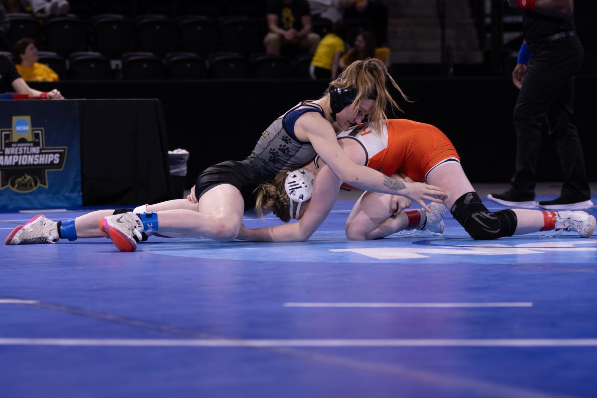 Freshman Gable Hemann wrestles her Adrian college opponent during her first match of day two. 