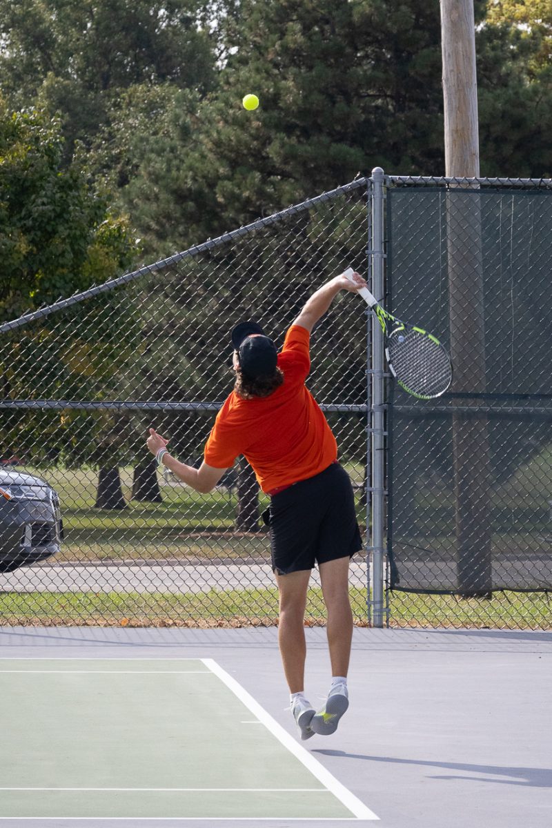 Junior Logan Augustine serves a ball during a match on September 14, 2025.