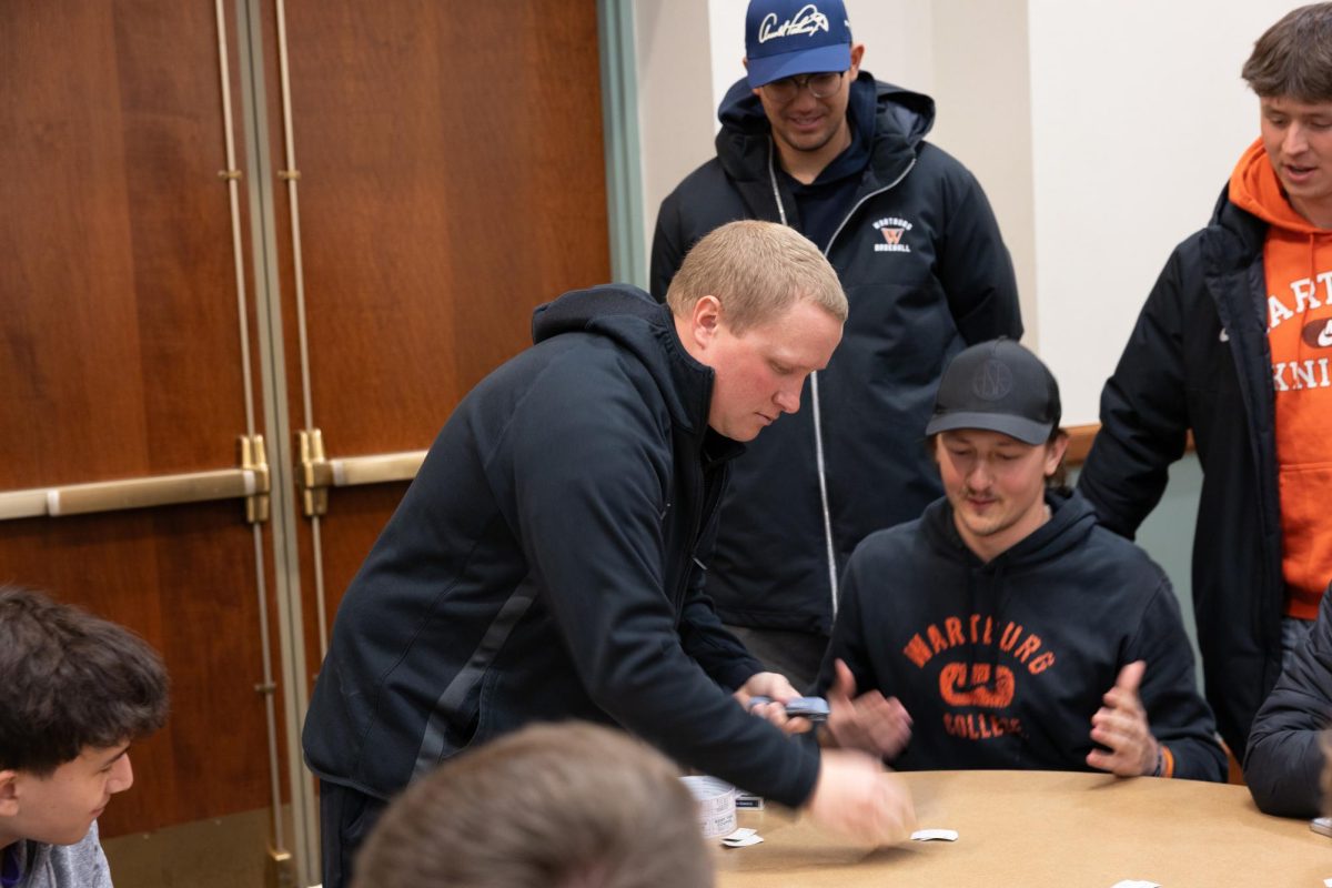 The dealer is giving a new card to the student in a game of blackjack.