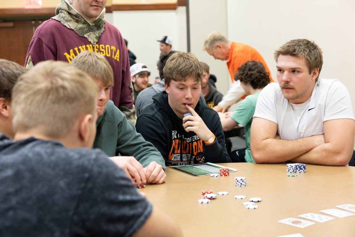 A student is in deep thought about his next move. 