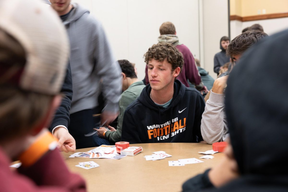 A Wartburg student is planning his next move to try and win the game.