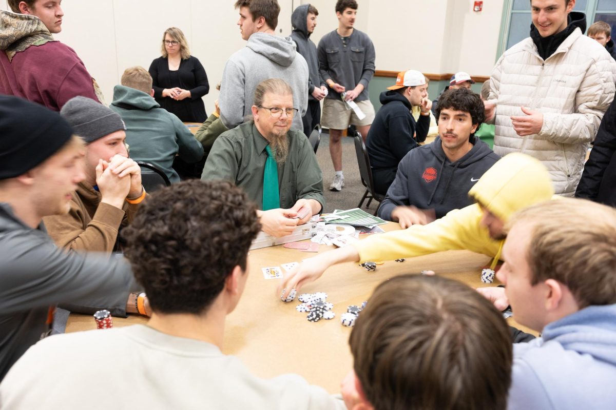 An intense game of poker is getting competitive between the students. 