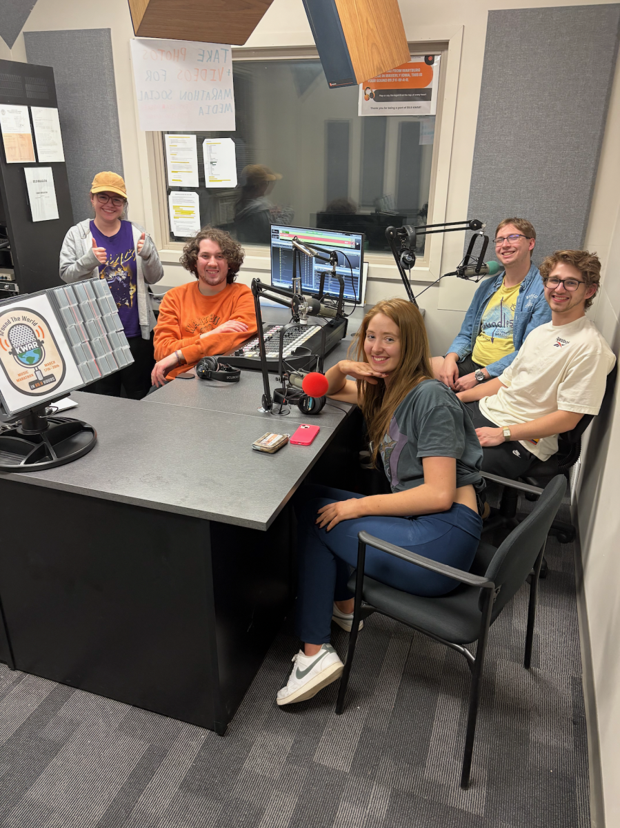 KWAR's staff gathers in the studio to finish the last hour of the 89.9-hour marathon together on air.