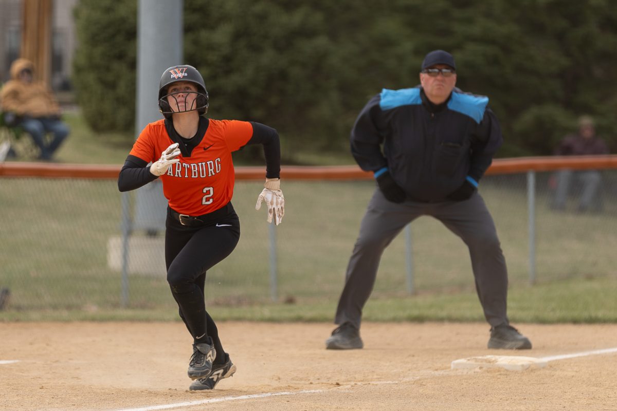 Junior Carley Bredar leads off third base to make her way to home plate, earning a run for the Knights. 