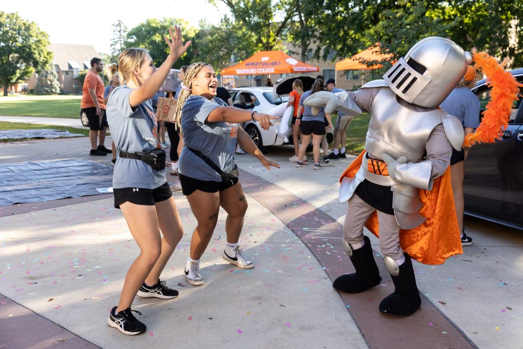 Sir Victor and student on move-in day.